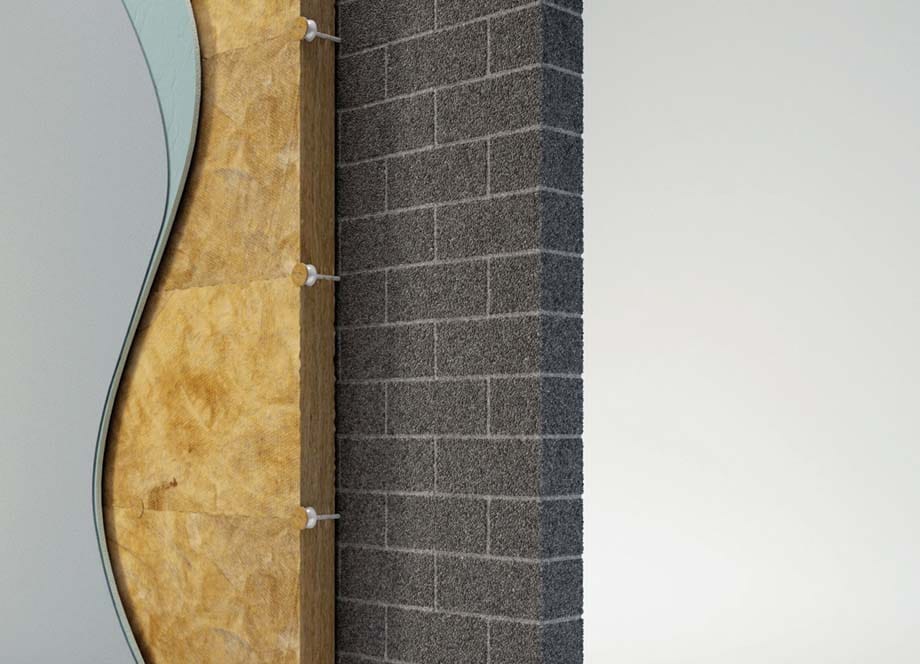 Prerez fasadnega zidu z izolacijo iz kamene volne in zaključnim slojem ometa